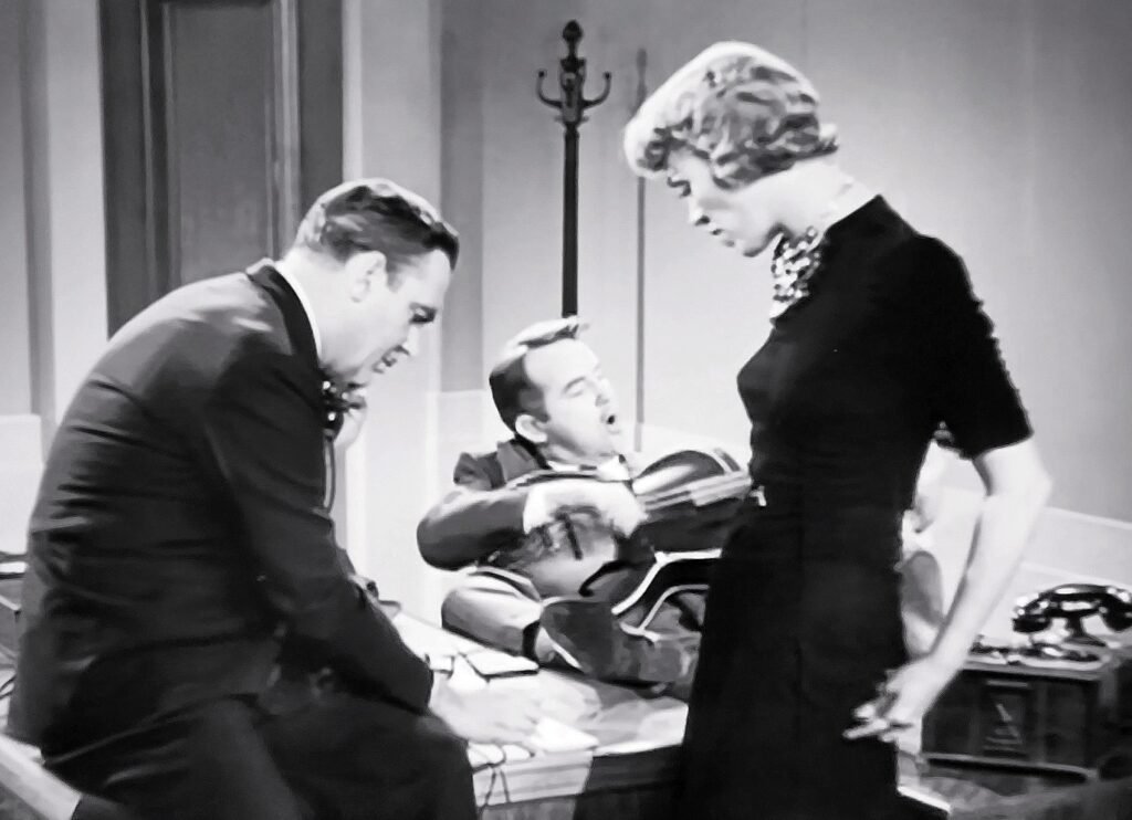 Pat O’Brien and Eve Arden in Slightly Honorable